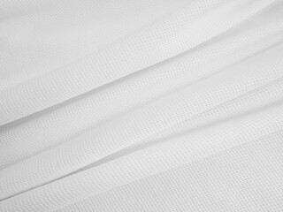 White crumpled fabric background. Wavy cloth texture