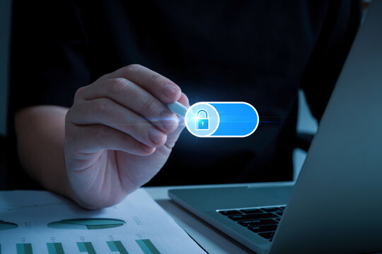 Data Protection. people hand using pen touch on digital lock button on data protection application program with laptop, cybersecurity, backup storage management, internet network technology concept