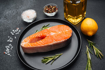 Fresh salmon fillet with herbs, lemon, and spices ready for cooking