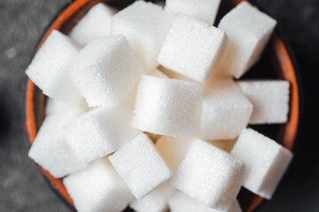Sugar cubes arranged neatly in a bowl ready for use in beverages