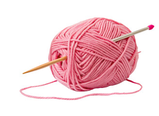 Pink yarn ball with knitting needles for crafting and sewing projects in cozy homemade creations