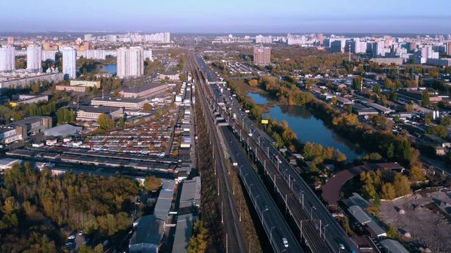 Scenic urban cityscape with highway bridge over the river. Aerial panoramic view from above.