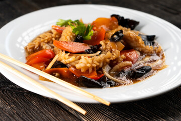 squid with vegetables on dark background. Asian food. Chinese cuisine. Seafood. Vegetables