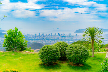 View of the city by the sea. 

Aerial view of the city in the distance. Nha Trang resort town in...