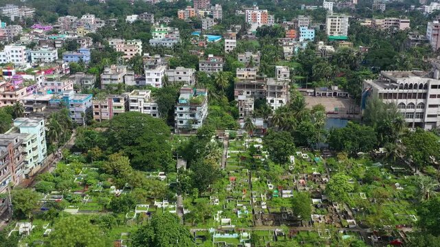 Barishal, Bangladesh - 23 August 2025: Aerial view of dense buildings interspersed with lush greenery, creating a vibrant tapestry of urban and natural landscapes.