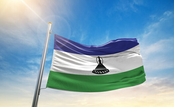 A vivid collection of national flags fluttering under the sunlit sky, representing the colors and pride of diverse nations around the world.