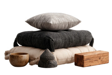 Stacked gray and black throw pillows, meditation accessories