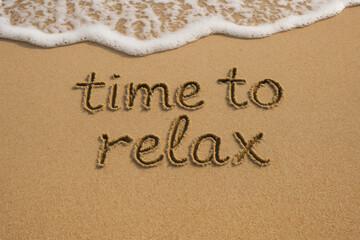 Fototapeta premium Time to relax inspires rest and leisure on soft sand along the peaceful beach shore