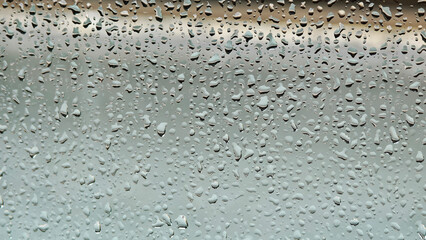 Raindrops stuck on the glass.