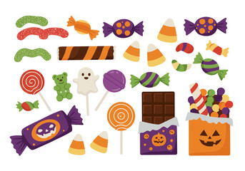 Fototapeta premium Halloween candy includes jelly worms lollipops candy corn chocolate and wrapped sweets in festive colors