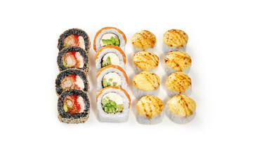 Sushi set displaying variety of rolls and nigiri on white background