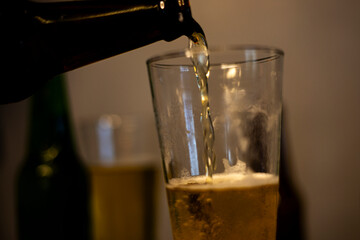Pouring Cold Beer Into Glass