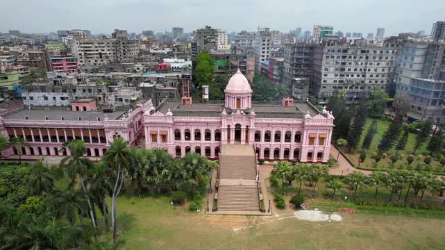 Dhaka, Bangladesh - 23 August 2025: Aerial view of the pink Ahsan Manzil palace contrasting with the surrounding urban landscape, a blend of old and new.