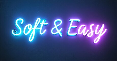 Obraz premium Bright neon sign displays text Soft Easy. Blue, purple hues create vibrant glow against dark background. Simple, modern design.