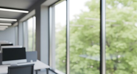 Blurred view of a modern office space with large windows.