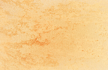 Brushed gold metallic texture with fine lines and shiny surface, elegant luxury background for design, branding, and decoration.