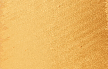 Brushed gold metallic texture with fine lines and shiny surface, elegant luxury background for design, branding, and decoration.