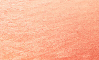 Peach plaster wall texture with soft rough surface and gradient shades, warm abstract background for design, art, and decoration.