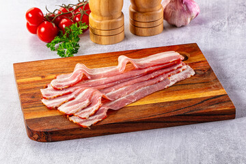 Raw bacon pork meat slices
