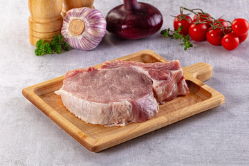 Raw pork steak with bone