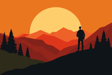 Silhouette of man watching sunset over the mountains
