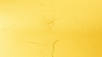 Golden plaster wall texture with subtle cracks and rough surface, elegant abstract background for luxury, festive, and decorative design.