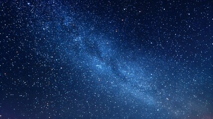 Obraz premium Starry Night Sky with Twinkling Stars Over a Horizon in a Clear Dark Sky