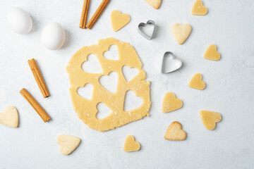 Heart cookie dough baking with cinnamon on marble surface for recipe, valentine or lifestyle concept