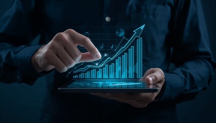 Hands holding a tablet displaying a futuristic glowing financial growth chart