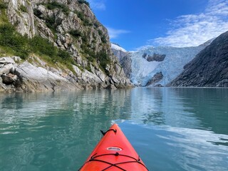 Orange kayak in a beautiful mountain valley Alaska wilderness landscape