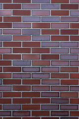 Fototapeta premium Close-Up of Red and Purple Clay Bricks in Stretcher Bond Pattern