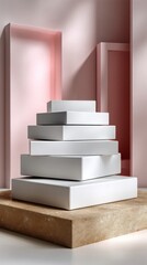 Stacked White Product Boxes Displayed on Textured Base Against Pastel Pink Background
