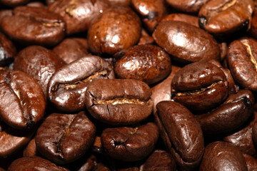 Close up of dark roasted coffee beans deep brown and tasty close up