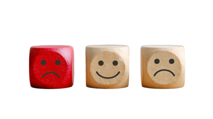 Wooden blocks showing happy and sad faces customer feedback