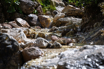 Water flowing in a small mountain river - Italy