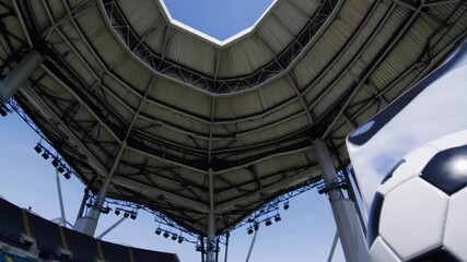 Soccer Ball and Laptop Computer with Blank Screen Placed on the Grass of Football Pitch at Stadium - Powered by Adobe
