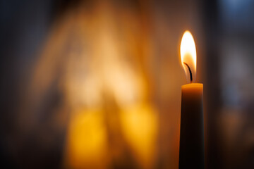 A lit candle in a restuarant