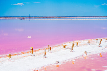 an incredibly beautiful natural phenomenon, a pink lake, a salt flat where salt is mined, with soft...
