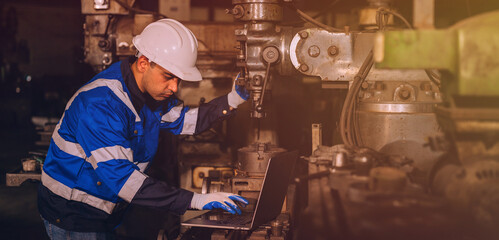 Technicians are working hard on lathes turning workpieces in advanced robotic welding plants in a world of modern technology.