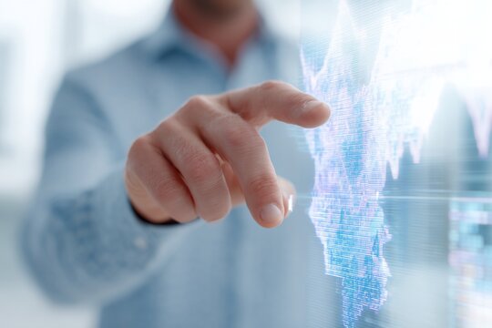 Man is pointing at a screen with a blue background.