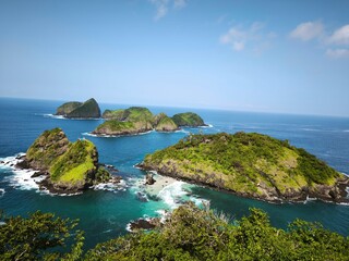 Aerial view of small green islands in the sea