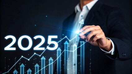 Businessman visualizing future growth with rising financial graph toward 2025, business success concept, innovation, and achievement