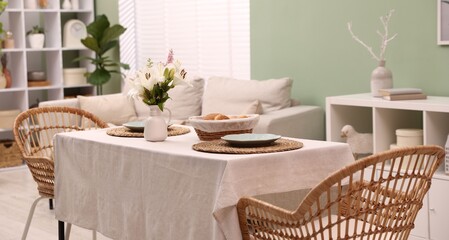 Stylish table with chairs and decor in dining room. Interior design