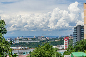 Obraz premium Vladivostok cityscape with modern buildings, Amur Bay, lush greenery, and sprawling urban districts in Russia's Far East. 