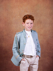 Photo session in the studio with a earth-toned background of both red-haired siblings for the communion day.