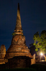 Fototapeta premium Landscape Historical Park in Ayutthaya. The ancient temple that presents humans is located in Thailand's Ayuddhaya Historic City. Ayutthaya World Heritage.