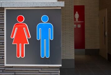 Toilet sign in Tokyo, Japan, with stylised male and female outline figures