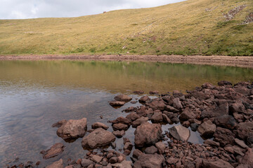 Remote Volcanic Lake in a Colorful Highland Crater