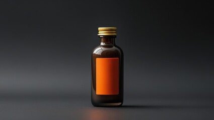 A dark brown glass bottle with an orange label sits on a dark gray surface, showcasing a simple and elegant design.