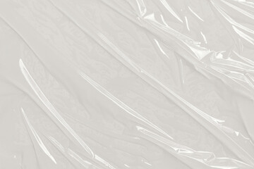 Wrinkled, creased plastic wrap with reflections  texture. Used for abstract backgrounds, packaging design, or digital overlays in design projects.